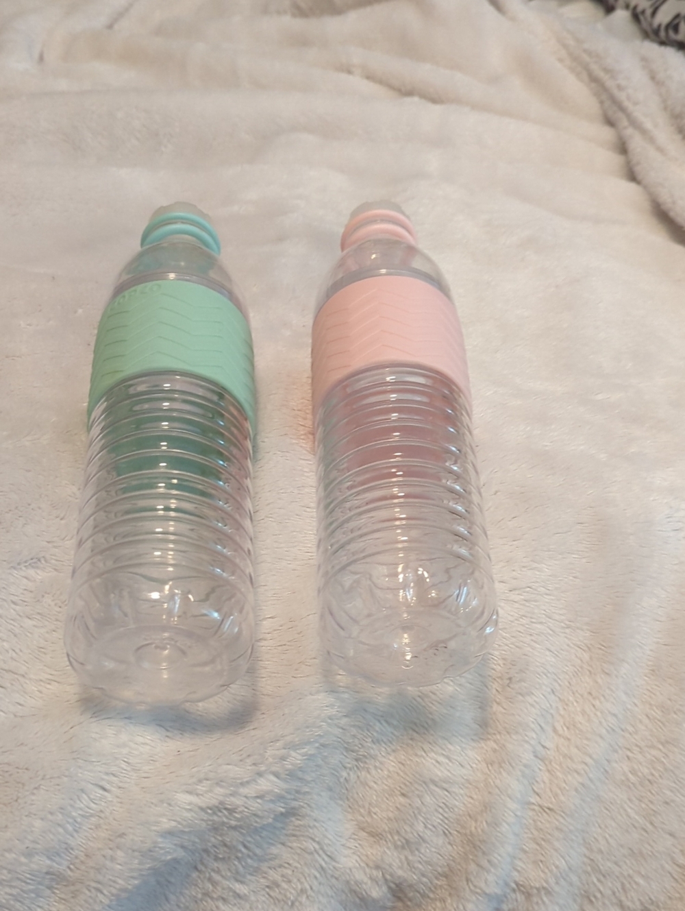 Clear Reusable Water Bottle Pair with Green and Blush Silicone Grips